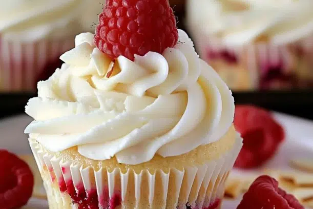 Almond Wedding Cake Cupcakes with Raspberry Filling